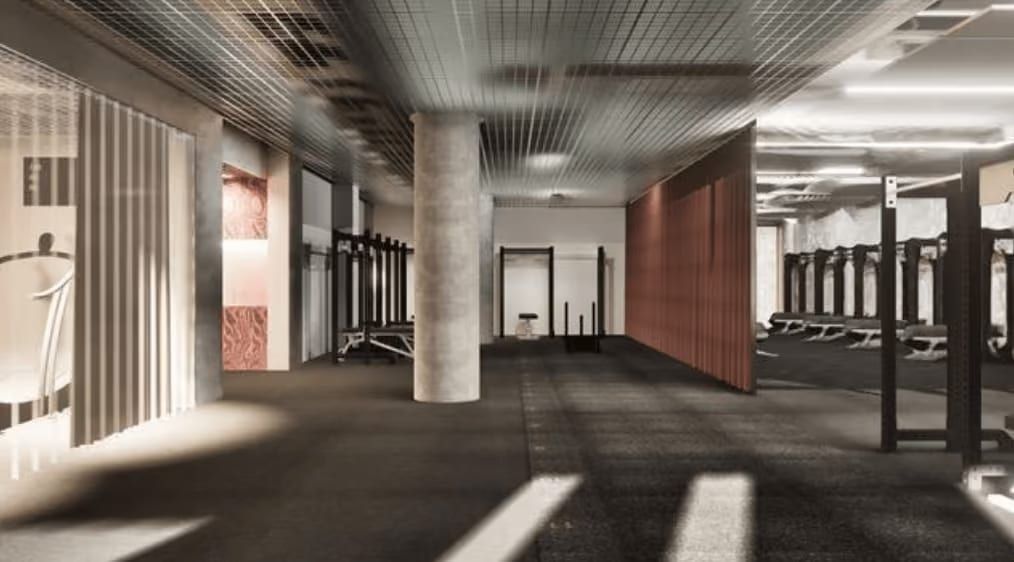 Rendering des Trainingsbereichs mit Racks und Hanteln, Betonsäulen und einem rostroten Vorhang.