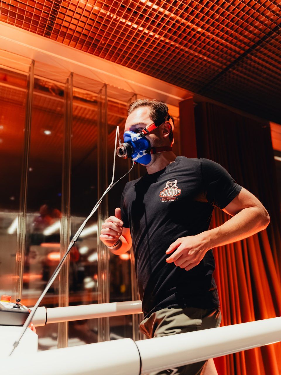 Running on the treadmill with a breathing mask during the VO₂max test